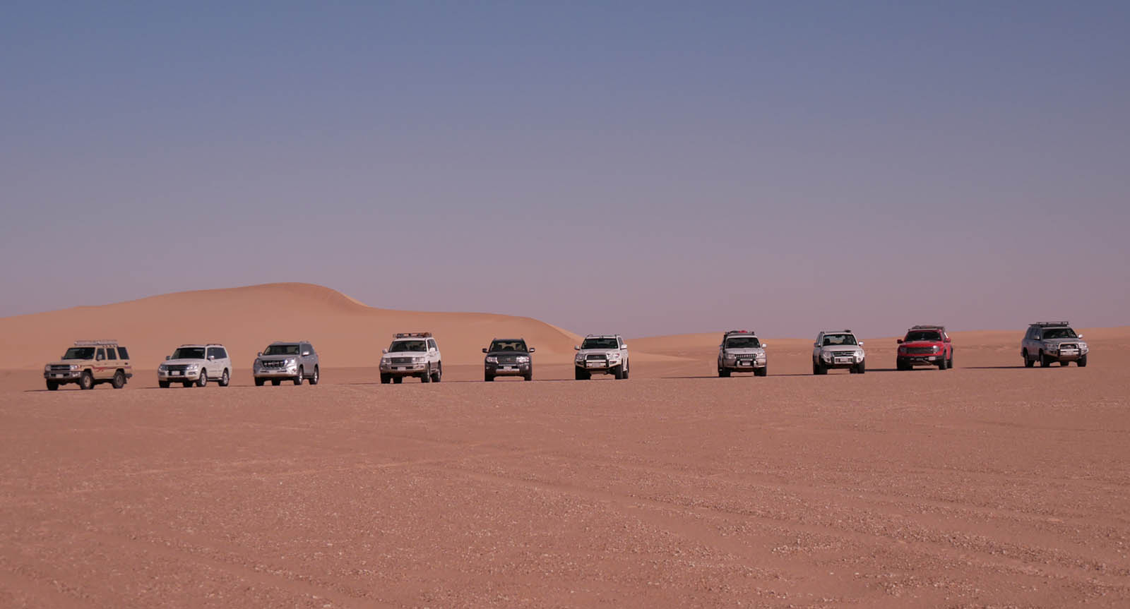 Desert trip convoy of 4x4 vehicles